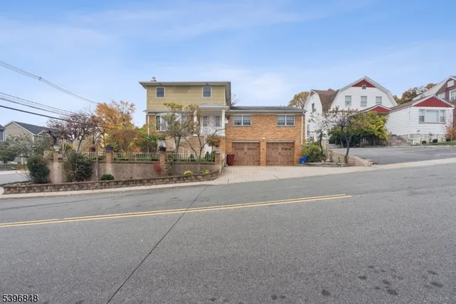 a view of a house with a street