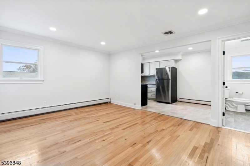 3 Witherspoon Street, Unit 2 Nutley, NJ 07110 - Photo 2 of 19 a view of an empty room with wooden floor