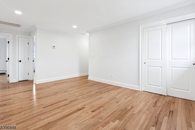 3 Witherspoon Street, Unit 2 Nutley, NJ 07110 - Photo 9 of 19 an empty room with wooden floor