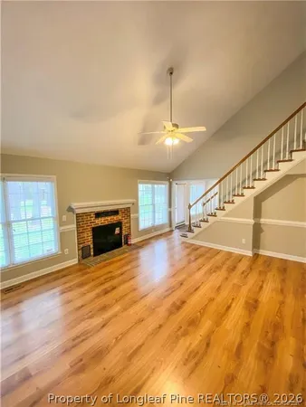 a view of an empty room with stairs