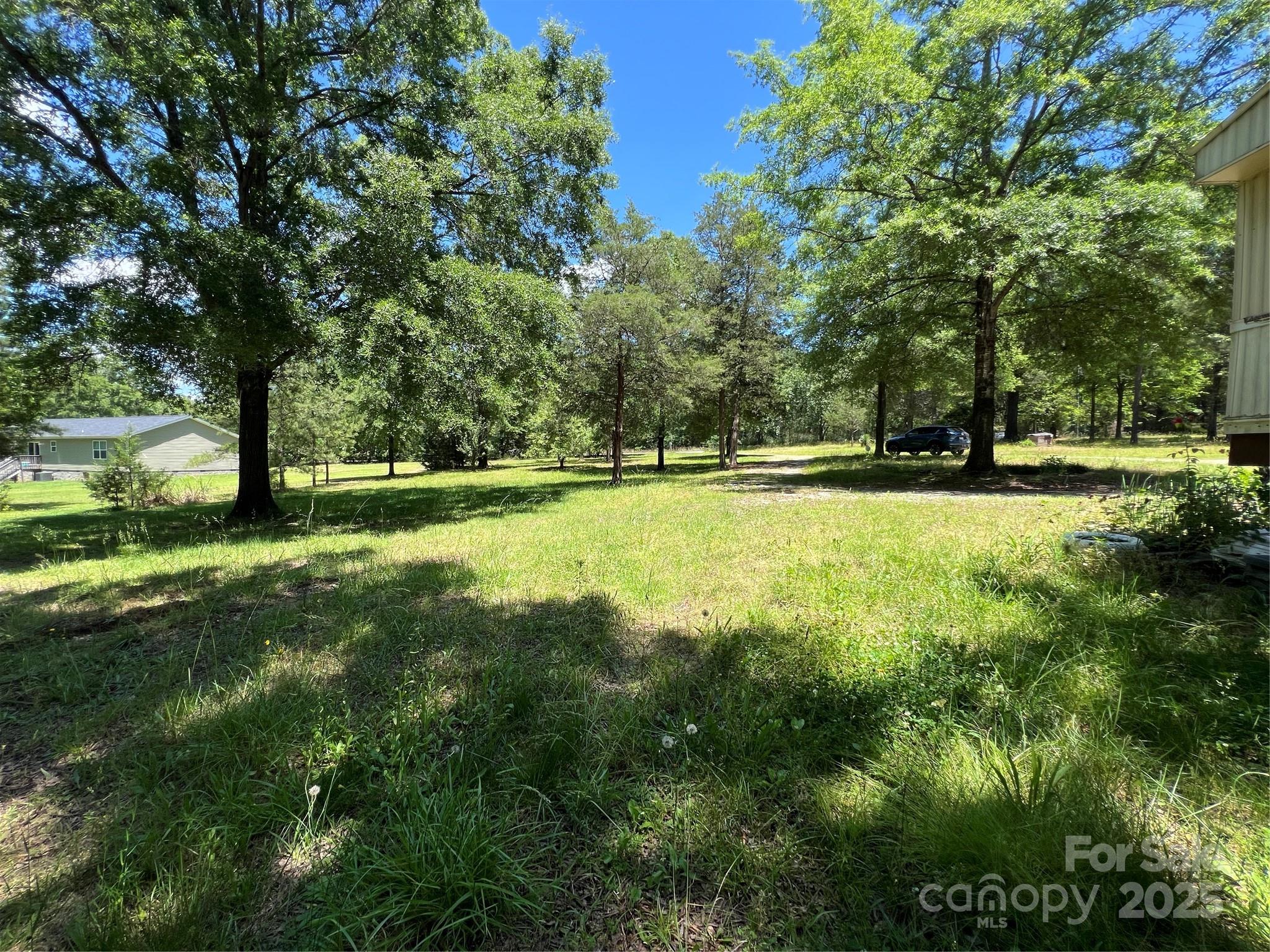 5655 Shirley Road Fort Lawn, SC 29714 - Photo 22 of 23 a view of a large yard with a large trees
