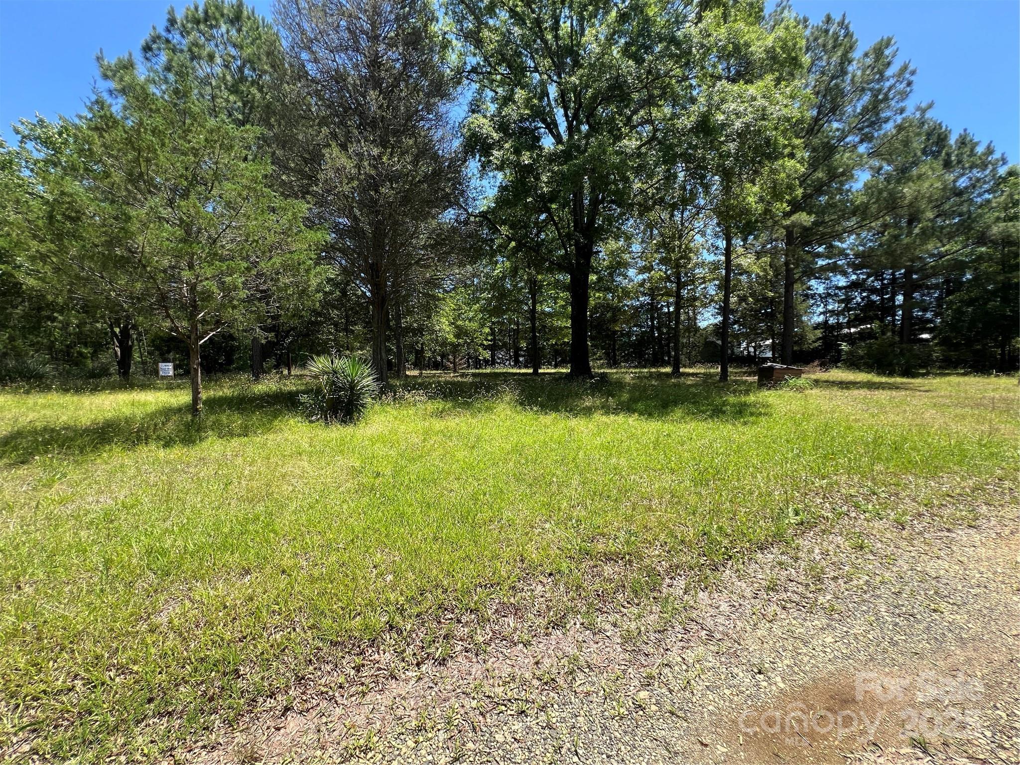 5655 Shirley Road Fort Lawn, SC 29714 - Photo 9 of 23 a view of a swimming pool and trees in the background