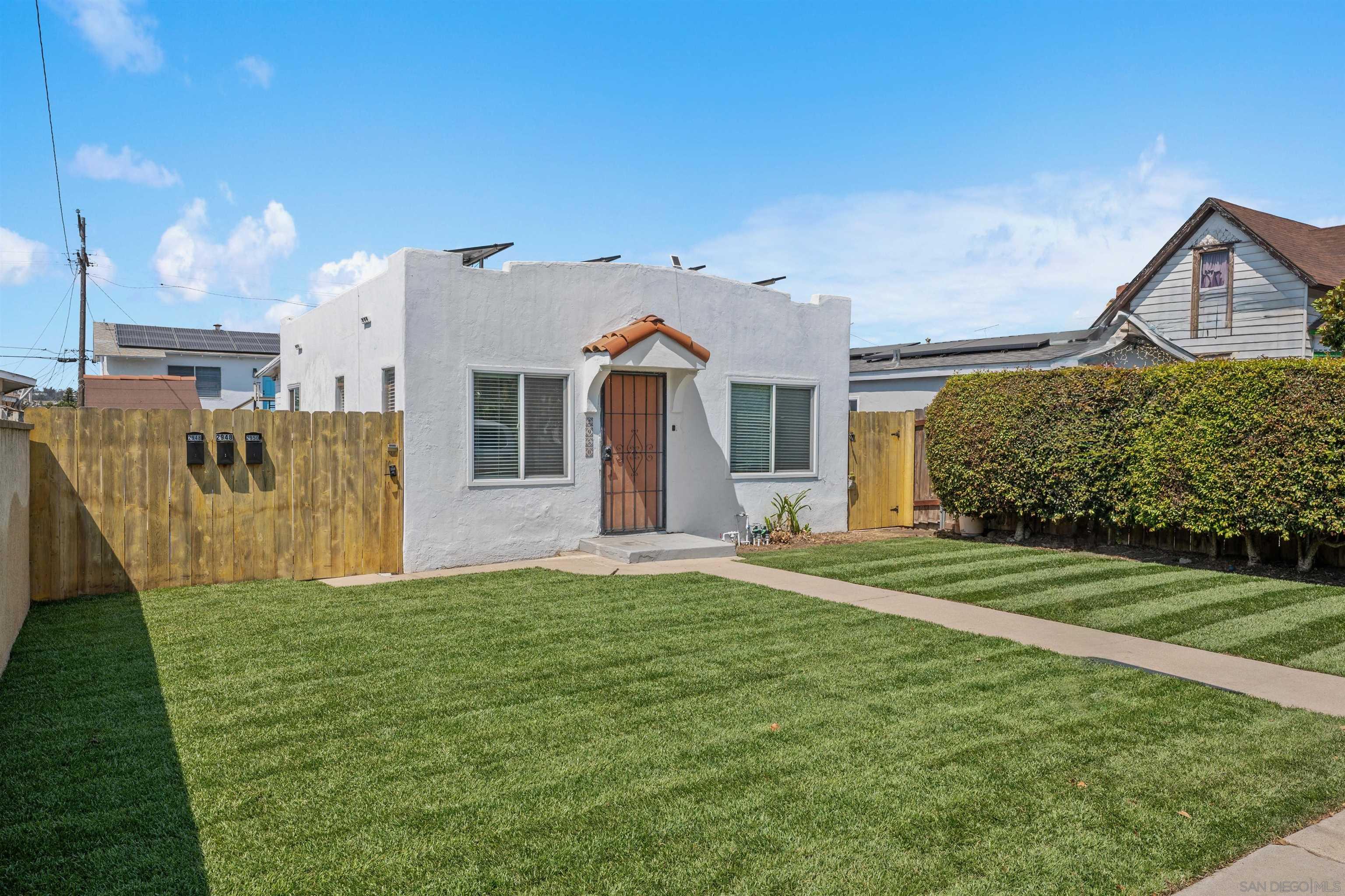 2948 Franklin Avenue San Diego, CA 92113 - Photo 1 of 47 a front view of a house with a yard