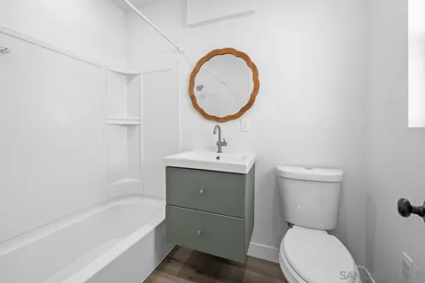 a bathroom with a sink a toilet and a bathtub
