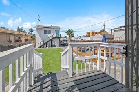 a view of a house with a yard porch and sitting area