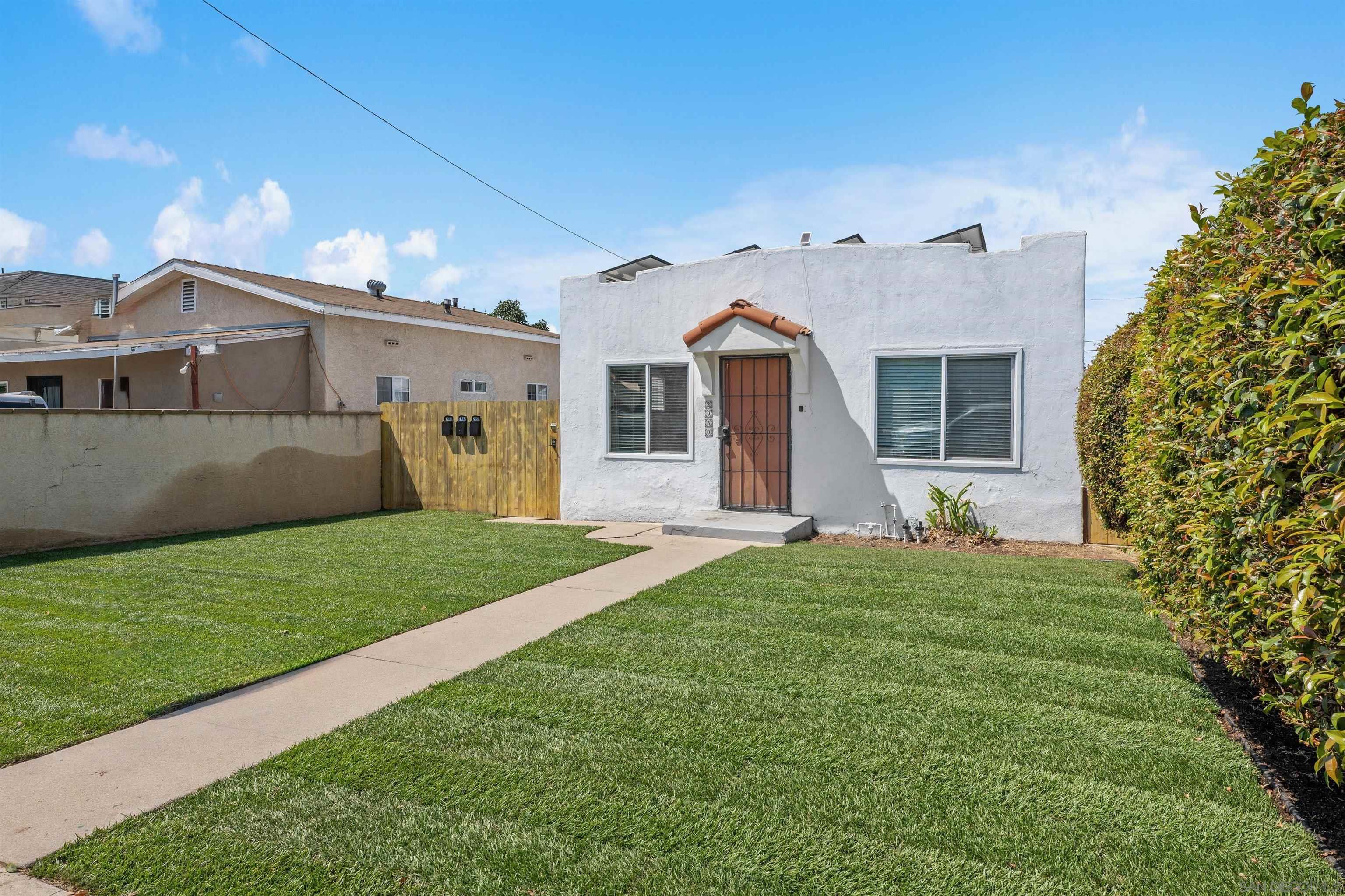 2948 Franklin Avenue San Diego, CA 92113 - Photo 2 of 47 a view of a yard in front of a house