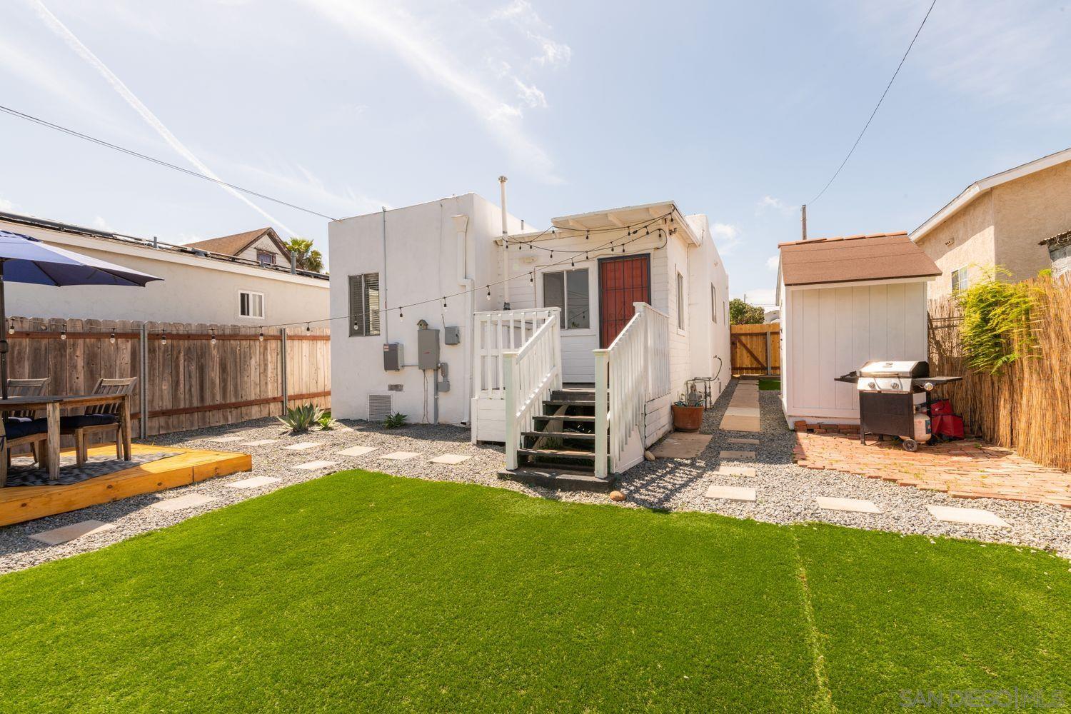 2948 Franklin Avenue San Diego, CA 92113 - Photo 24 of 47 a view of a house with a yard and furniture
