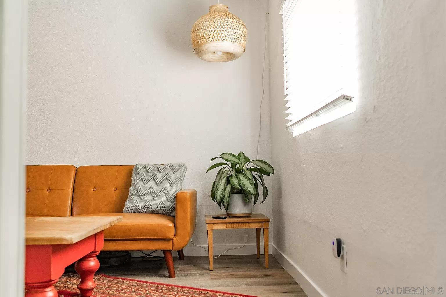 2948 Franklin Avenue San Diego, CA 92113 - Photo 30 of 47 a living room with furniture and a window