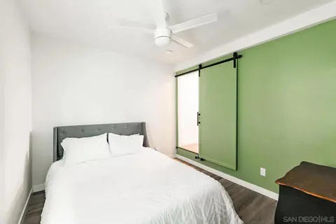 a bedroom with a bed and a closet