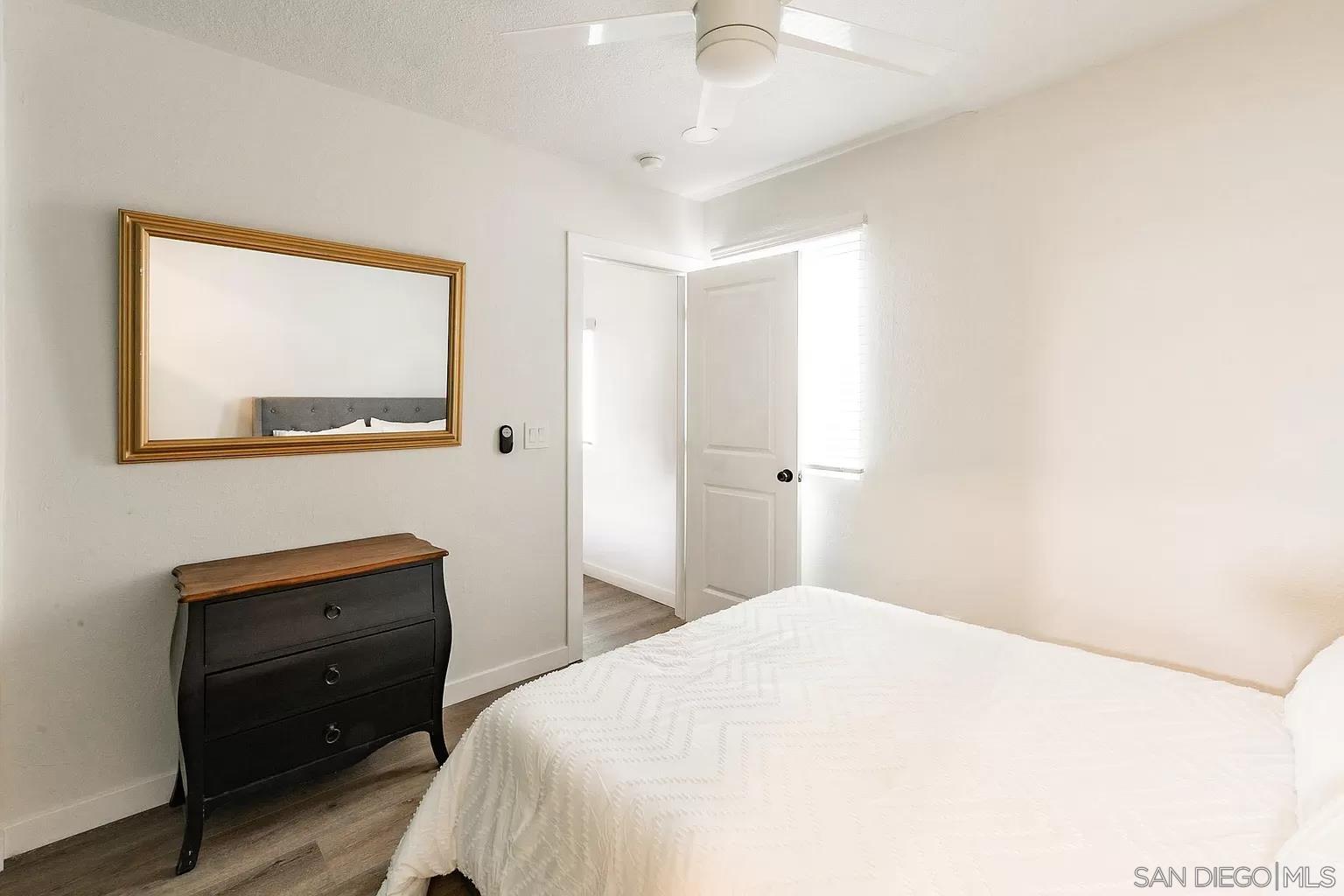 2948 Franklin Avenue San Diego, CA 92113 - Photo 34 of 47 a bedroom with a bed and a closet