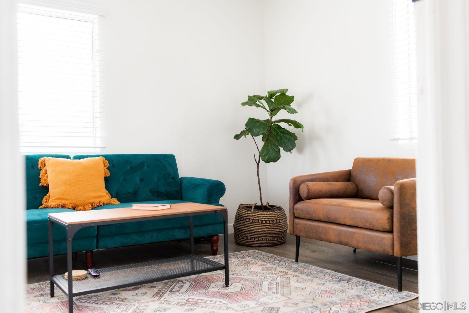 2948 Franklin Avenue San Diego, CA 92113 - Photo 40 of 47 a living room with furniture and a potted plant