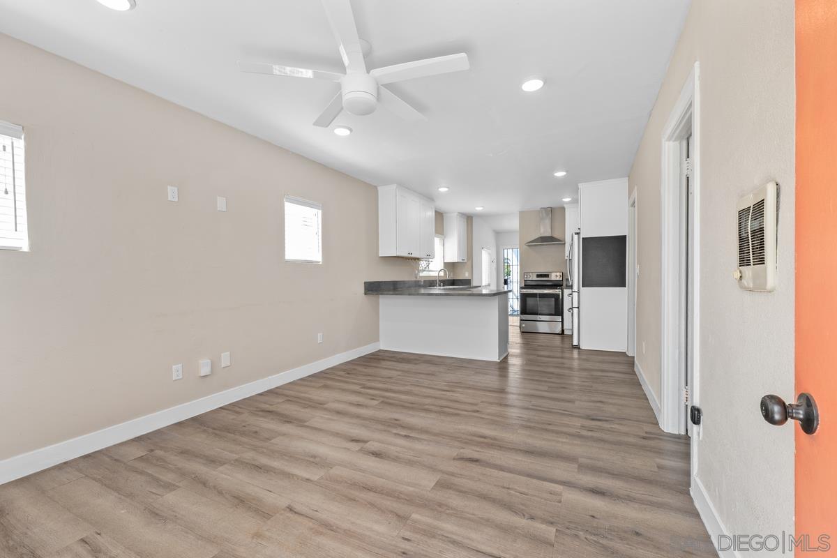 2948 Franklin Avenue San Diego, CA 92113 - Photo 4 of 47 a view of kitchen with wooden floor