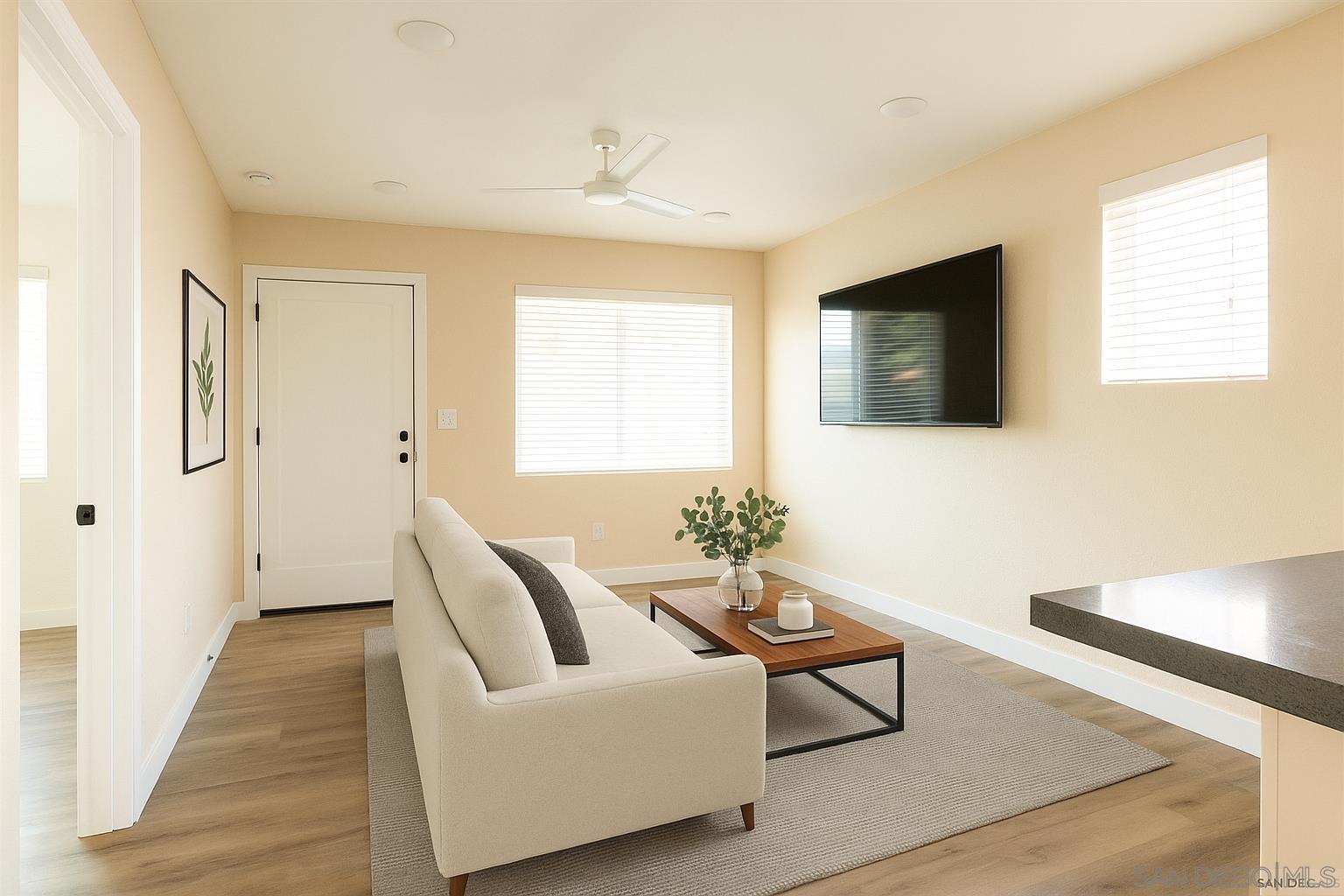2948 Franklin Avenue San Diego, CA 92113 - Photo 7 of 47 a living room with furniture and a flat screen tv