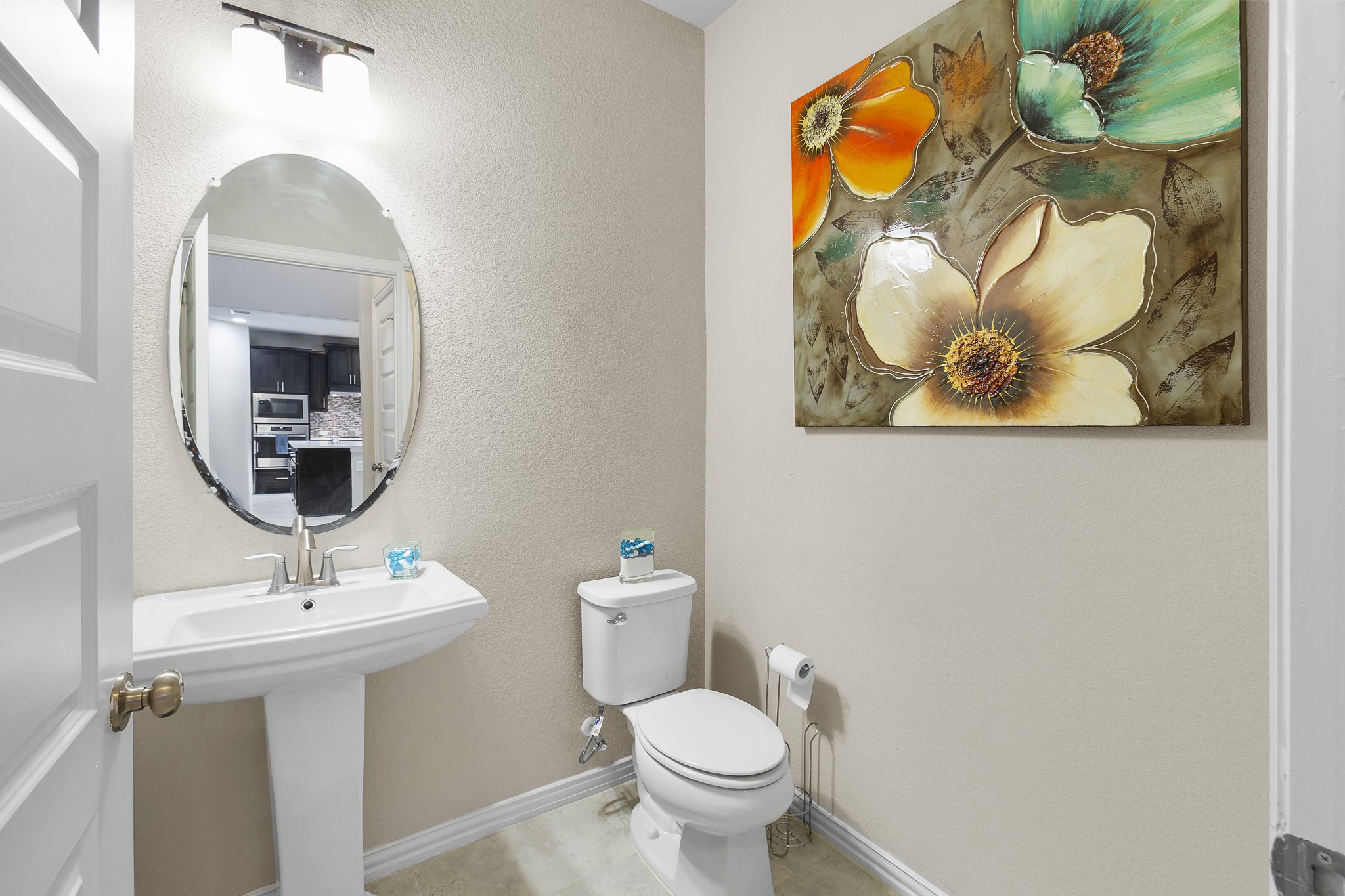 8709 Slater Drive Austin, TX 78747 - Photo 21 of 36 a bathroom with a toilet sink and mirror