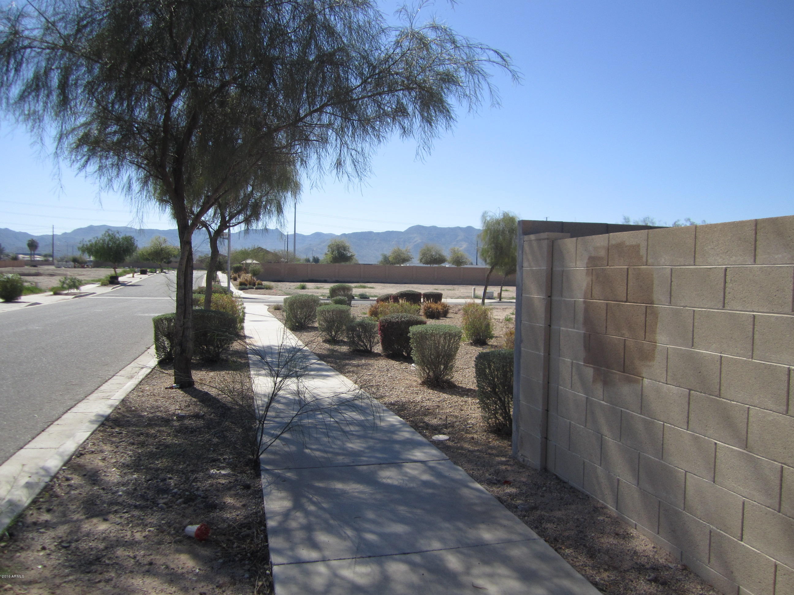 1209 West Fremont Rd. Phoenix, AZ 85041 - Photo 9 of 27 SIDEWALK BESIDE HOUSE