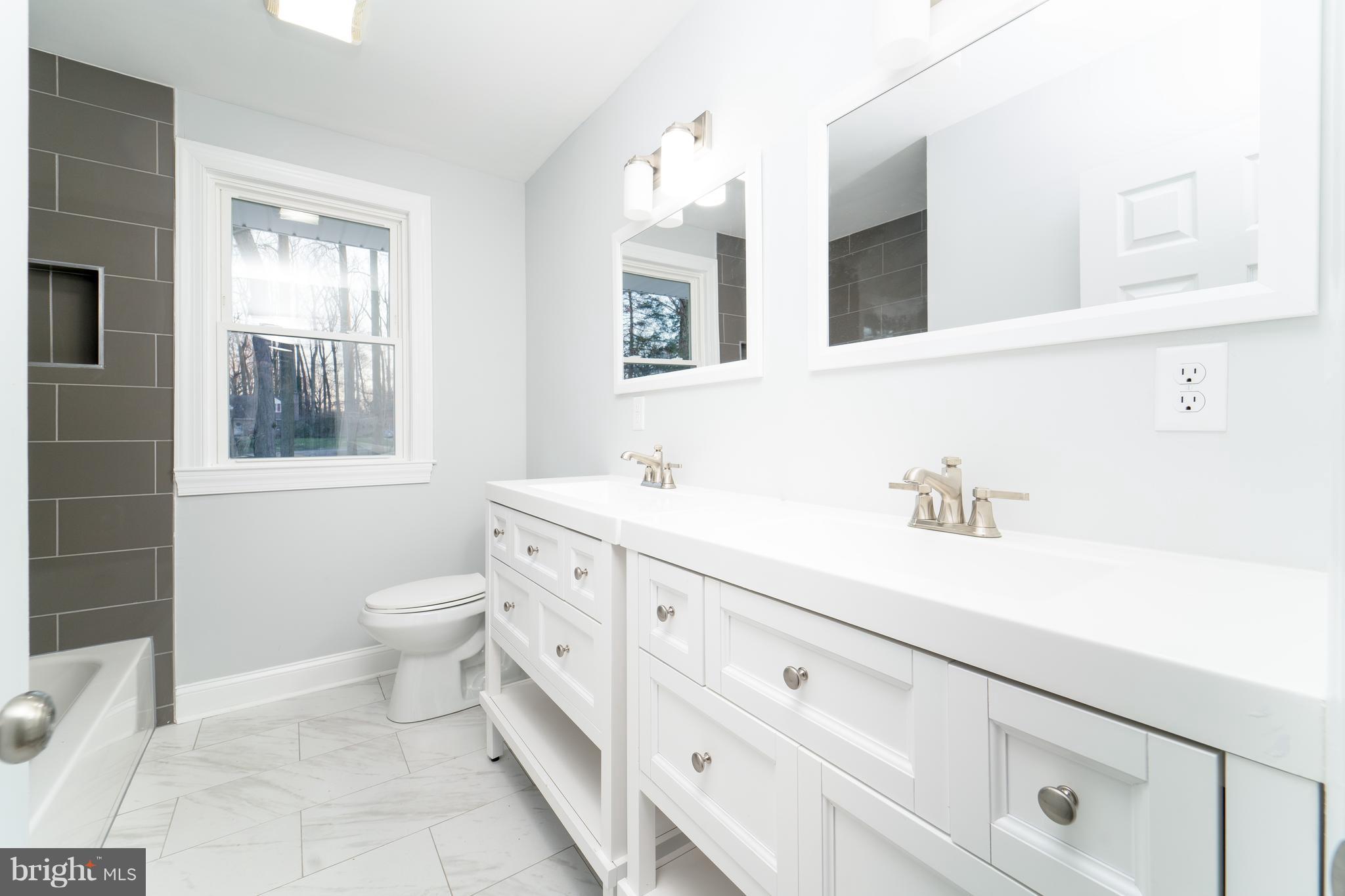 1233 Evergreen Road Wilmington, DE 19803 - Photo 18 of 23 Hall Bath with Tub and Two Vanities and Sinks