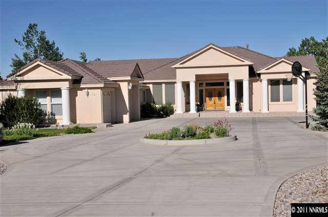 70 Autumn Lane Reno, NV 89511 - Photo 1 of 1 a front view of a house with a yard and potted plants