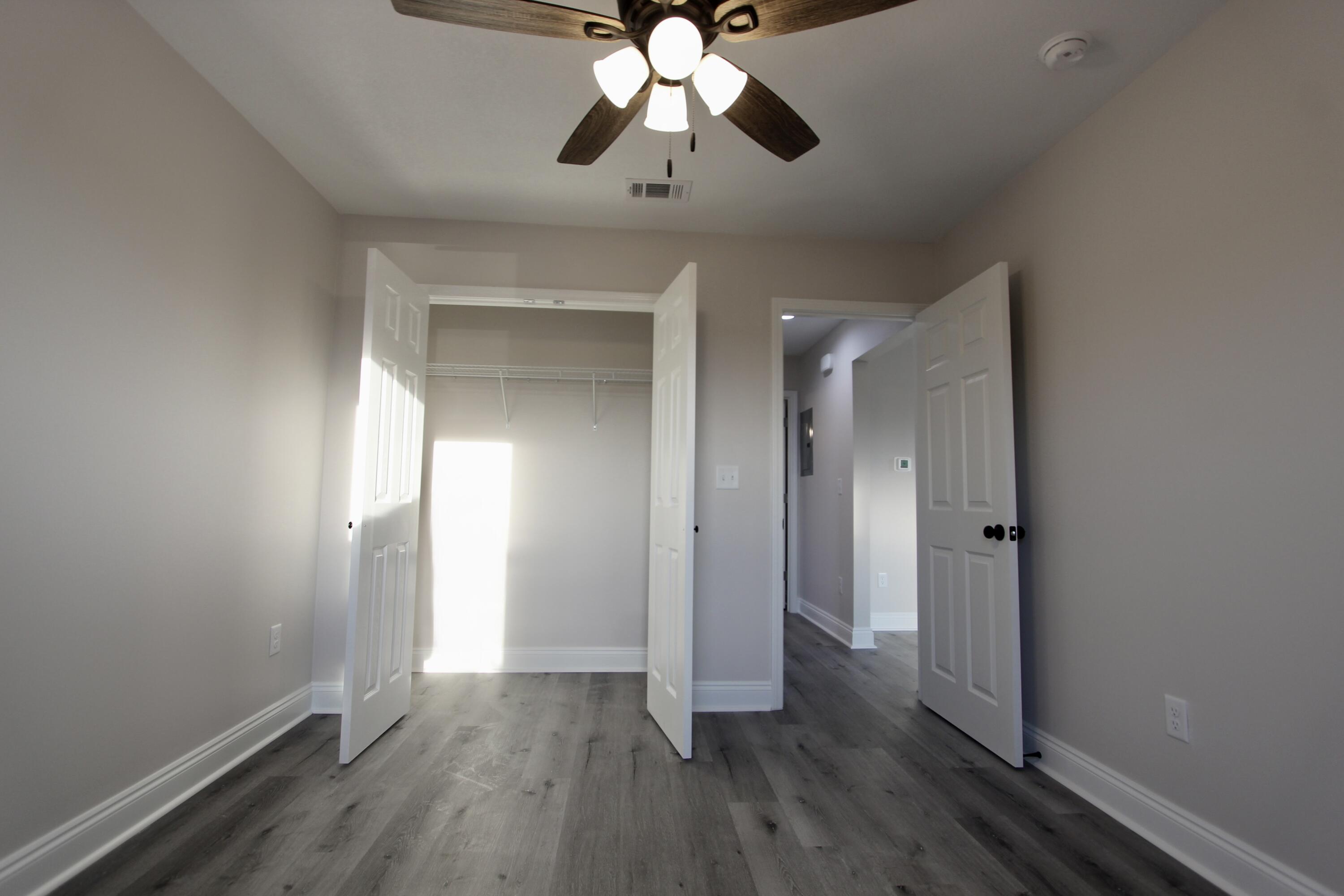 5437 Bayleaf Drive Crestview, FL 32539 - Photo 19 of 35 a view of empty room with wooden floor