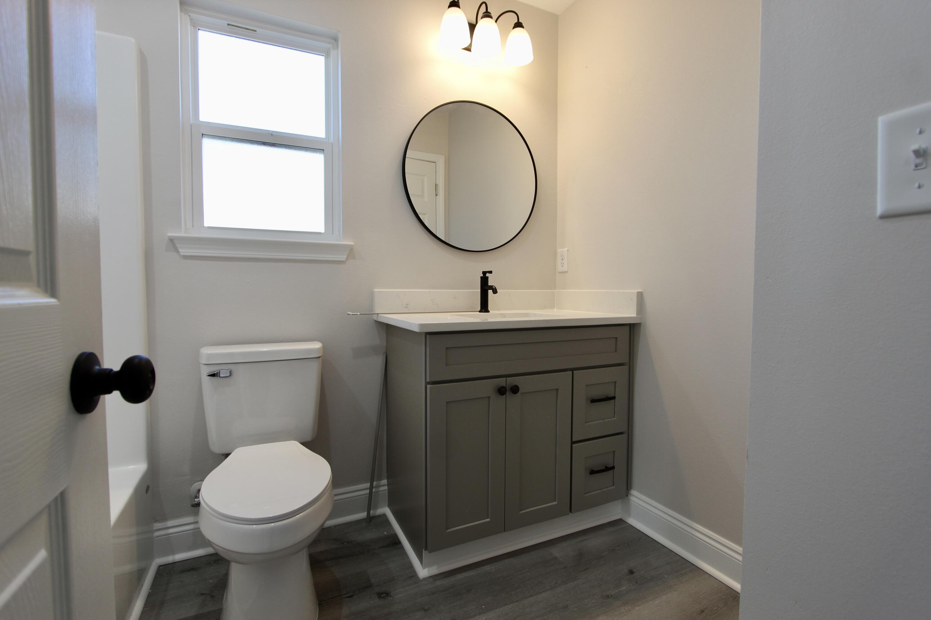 5437 Bayleaf Drive Crestview, FL 32539 - Photo 20 of 35 a bathroom with a toilet sink and mirror