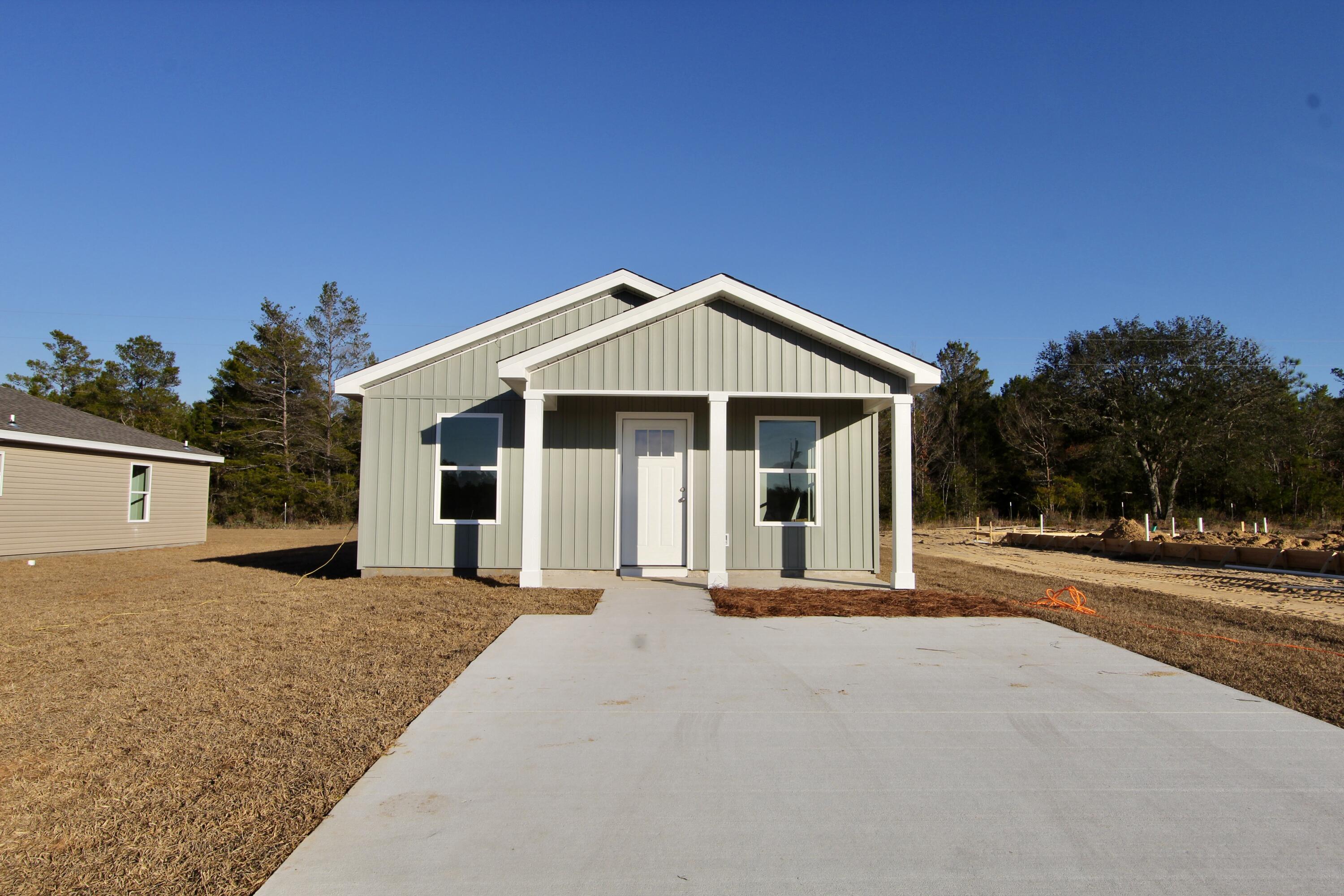 5437 Bayleaf Drive Crestview, FL 32539 - Photo 2 of 35 a front view of a house with a yard