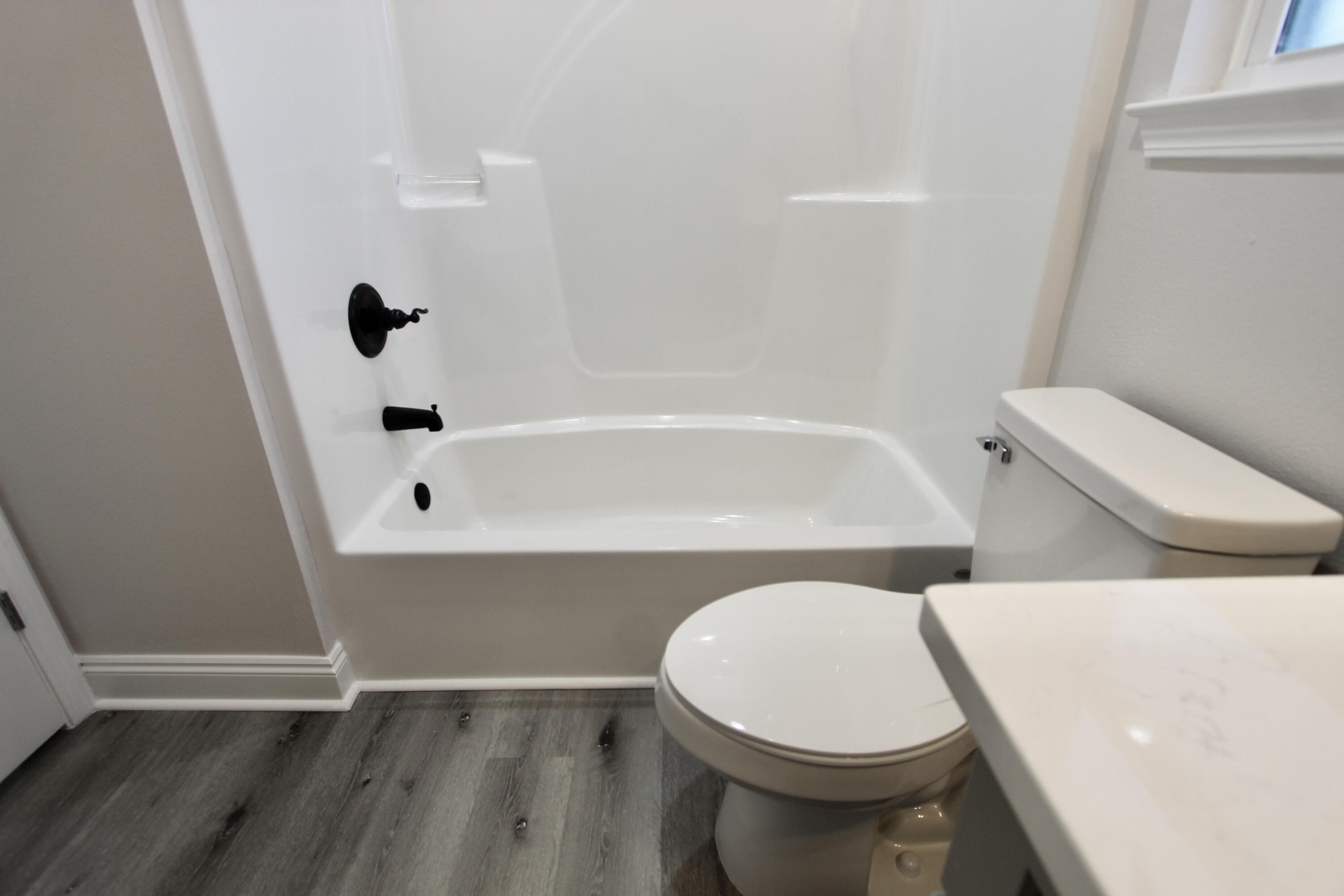 5437 Bayleaf Drive Crestview, FL 32539 - Photo 21 of 35 a bathroom with a toilet and a bathtub