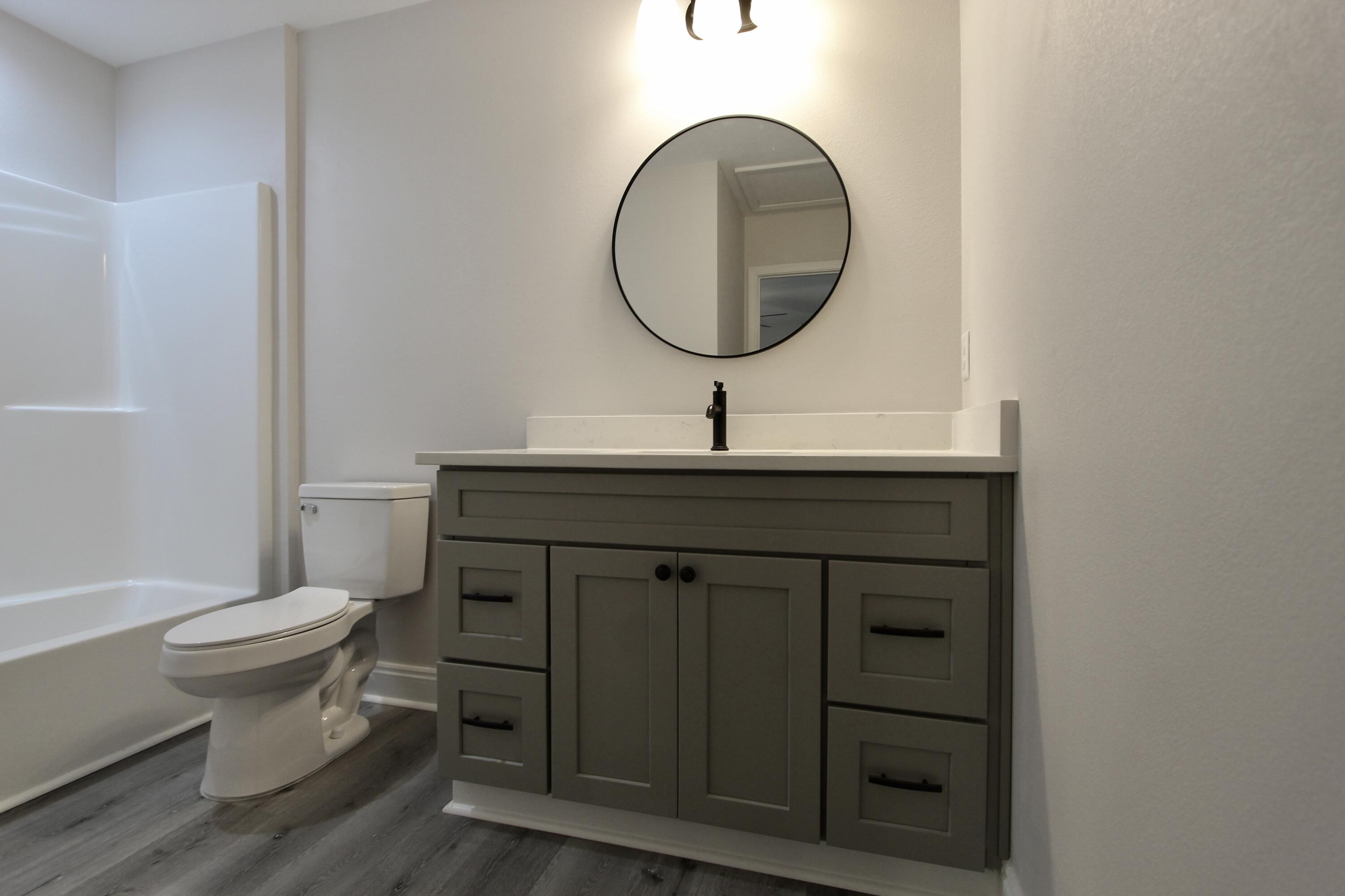 5437 Bayleaf Drive Crestview, FL 32539 - Photo 25 of 35 a bathroom with a sink and a mirror