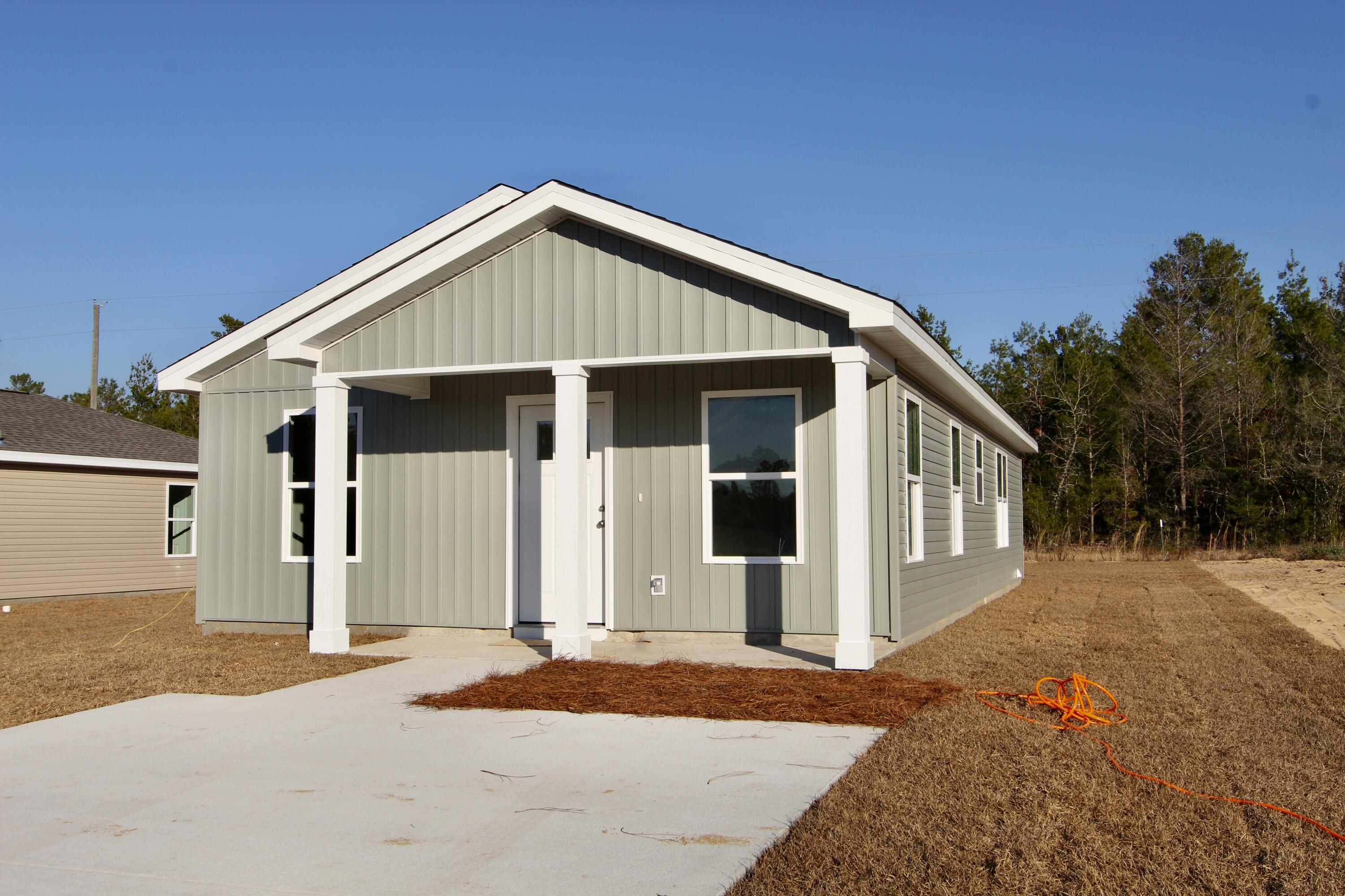 5437 Bayleaf Drive Crestview, FL 32539 - Photo 4 of 35 a front view of a house with a yard