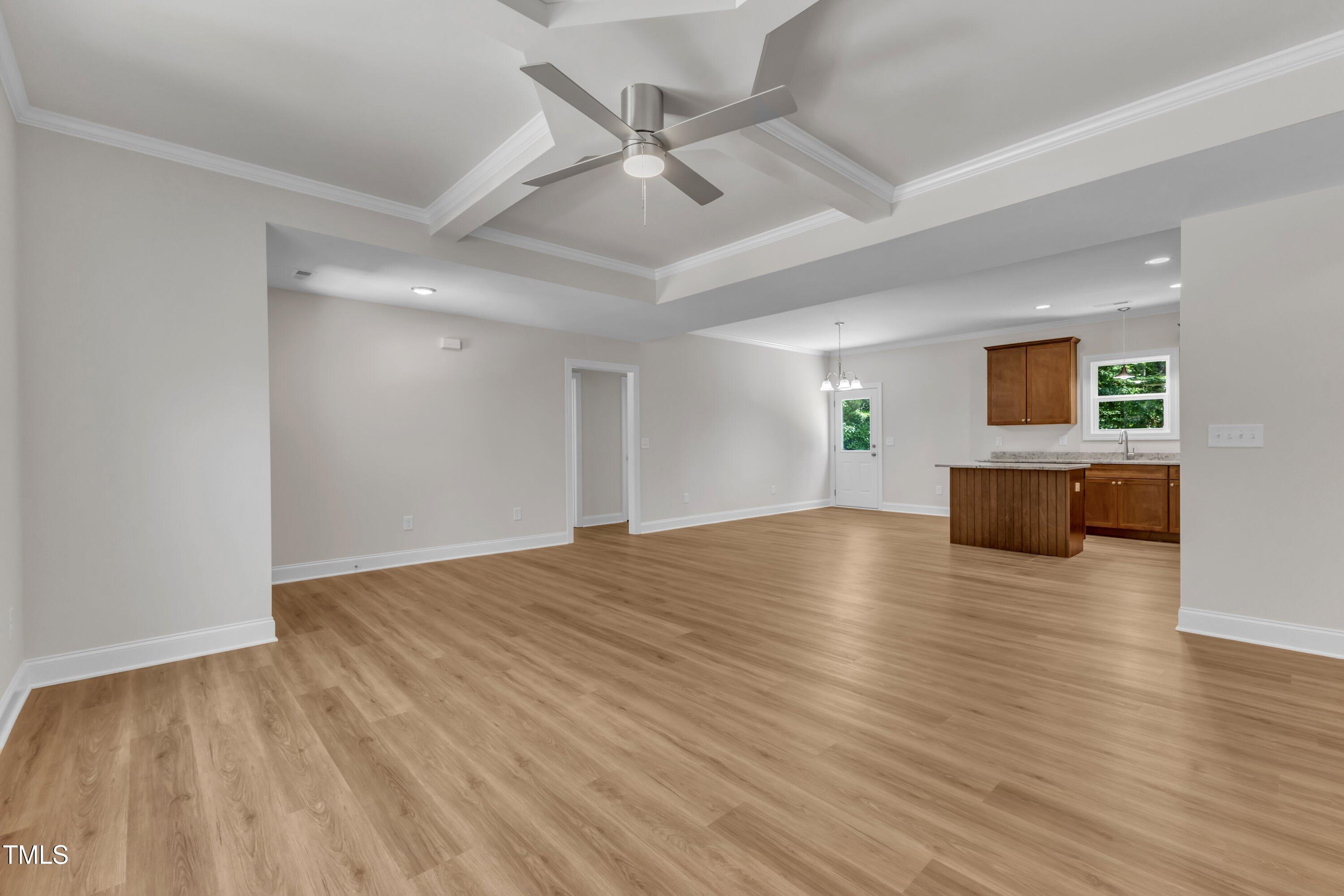125 Davis Street Louisburg, NC 27549 - Photo 10 of 39 a view of empty room with wooden floor