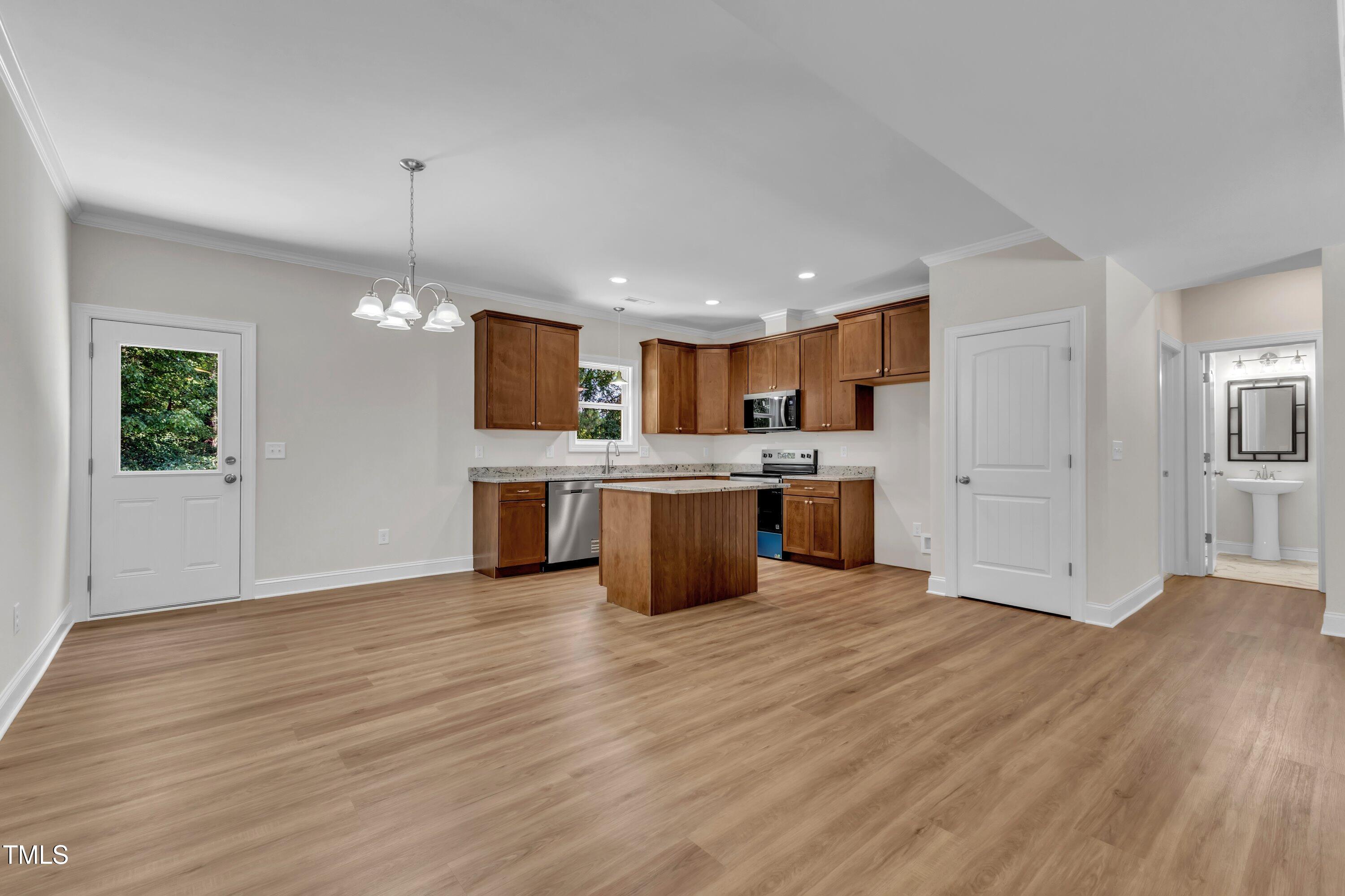125 Davis Street Louisburg, NC 27549 - Photo 12 of 39 a view of kitchen with cabinets and wooden floor