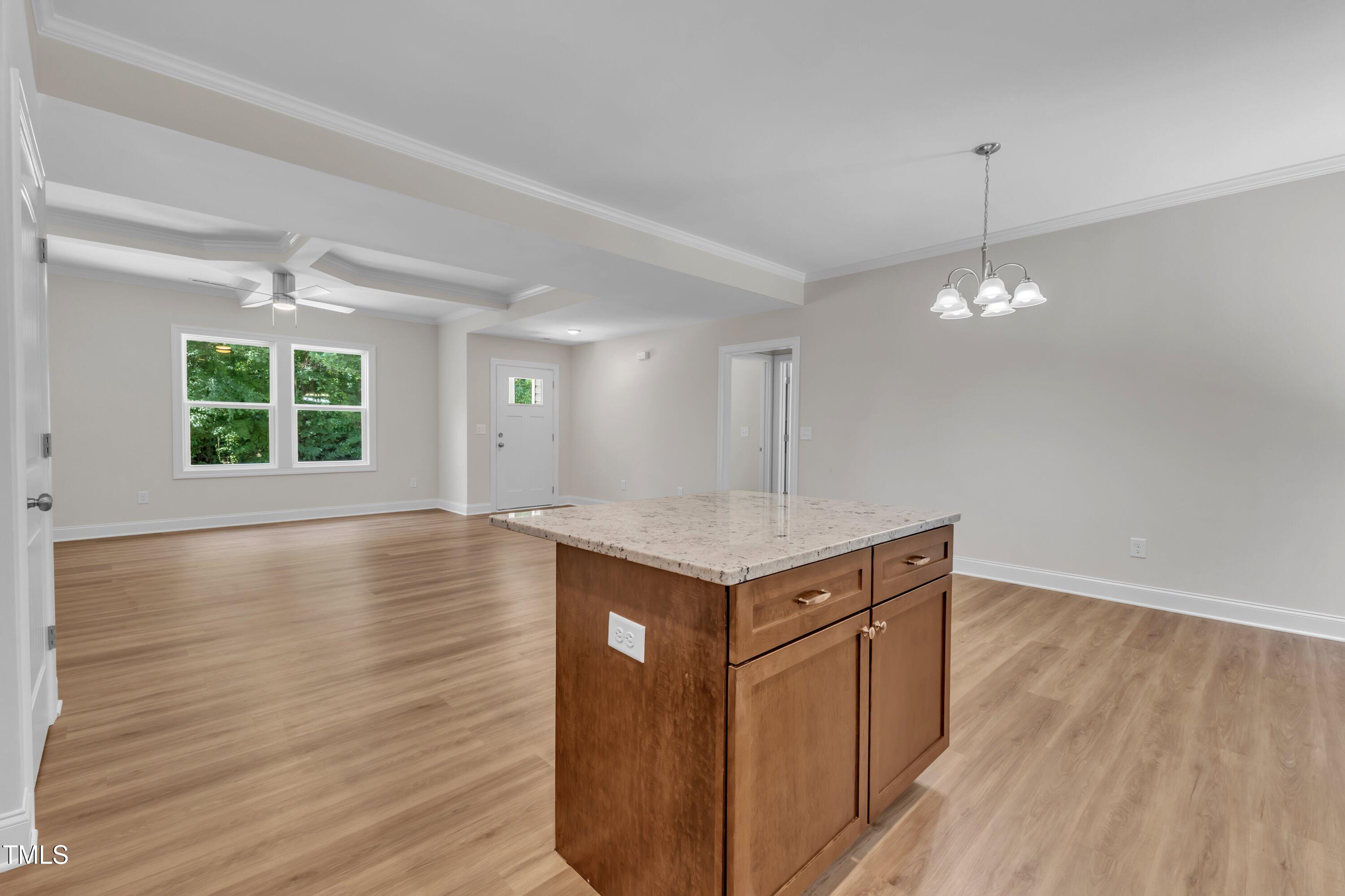 125 Davis Street Louisburg, NC 27549 - Photo 16 of 39 a kitchen with a wooden floor and window