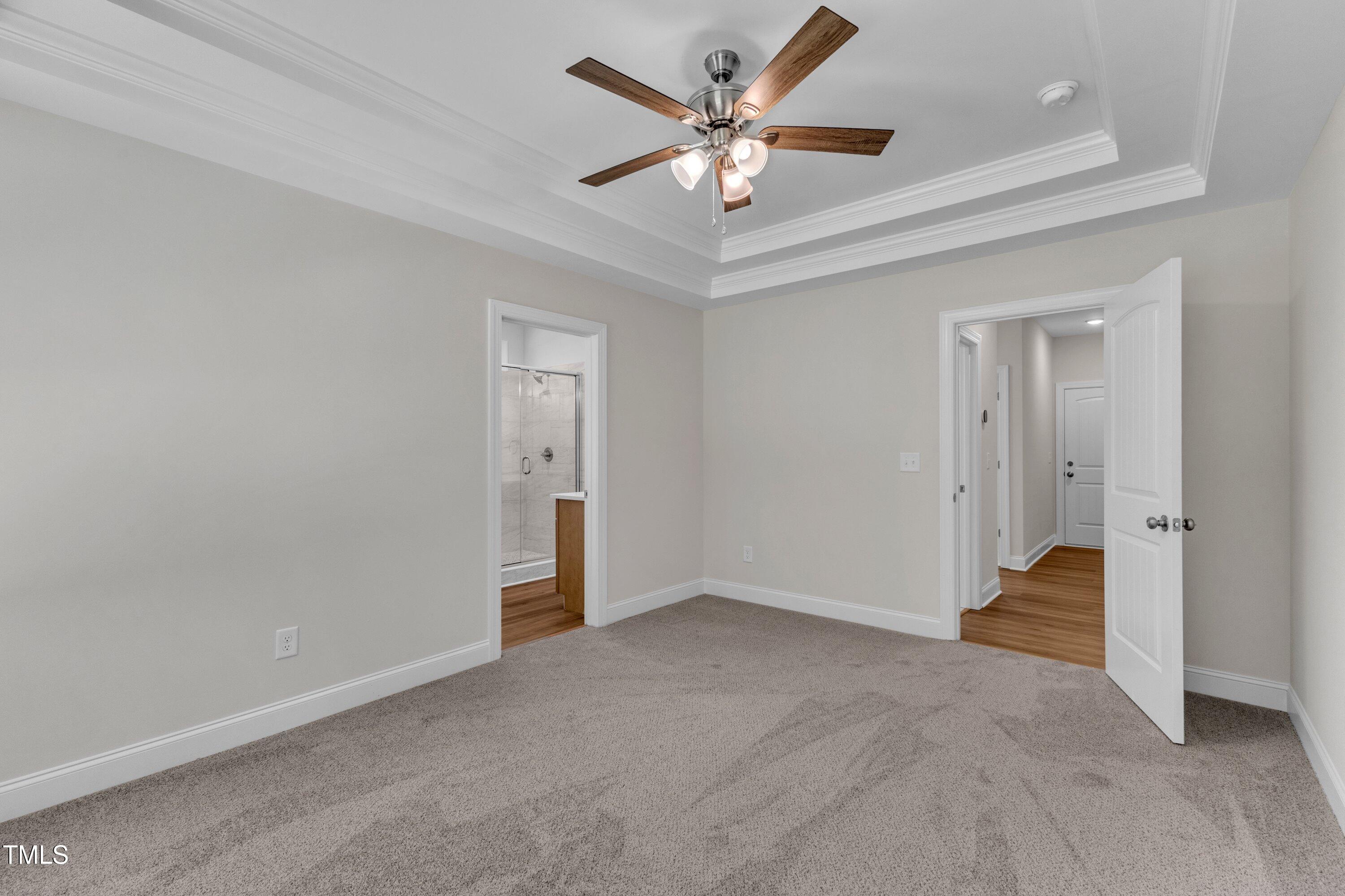125 Davis Street Louisburg, NC 27549 - Photo 21 of 39 an empty room with closet and a ceiling fan