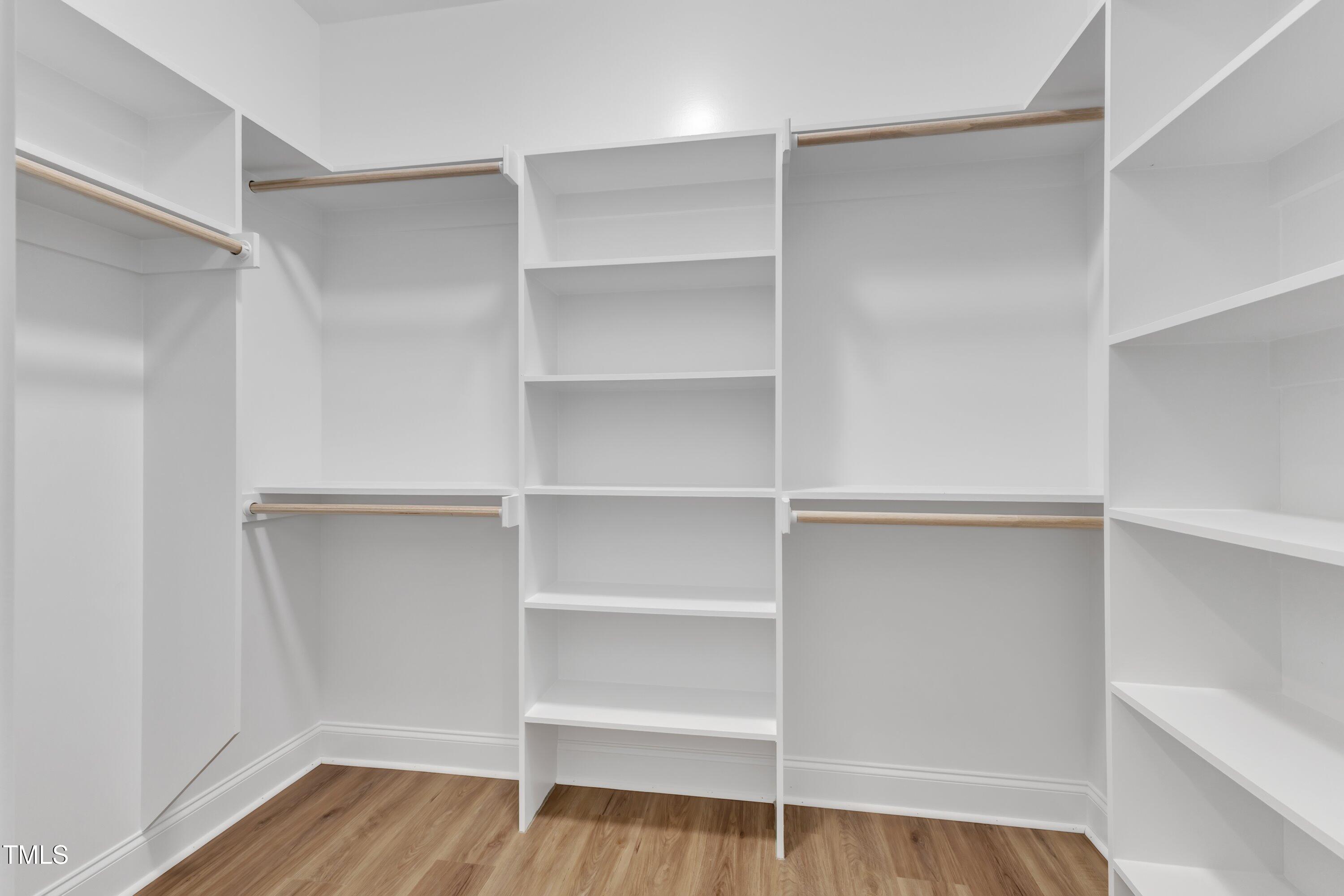 125 Davis Street Louisburg, NC 27549 - Photo 28 of 39 a view of walk in closet with empty racks