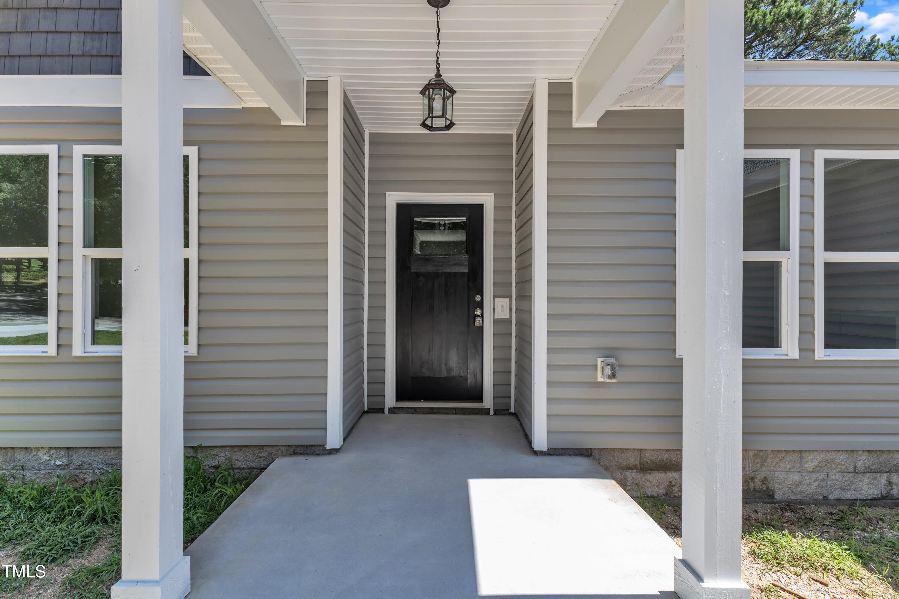 125 Davis Street Louisburg, NC 27549 - Photo 2 of 39 a front view of a house with a balcony