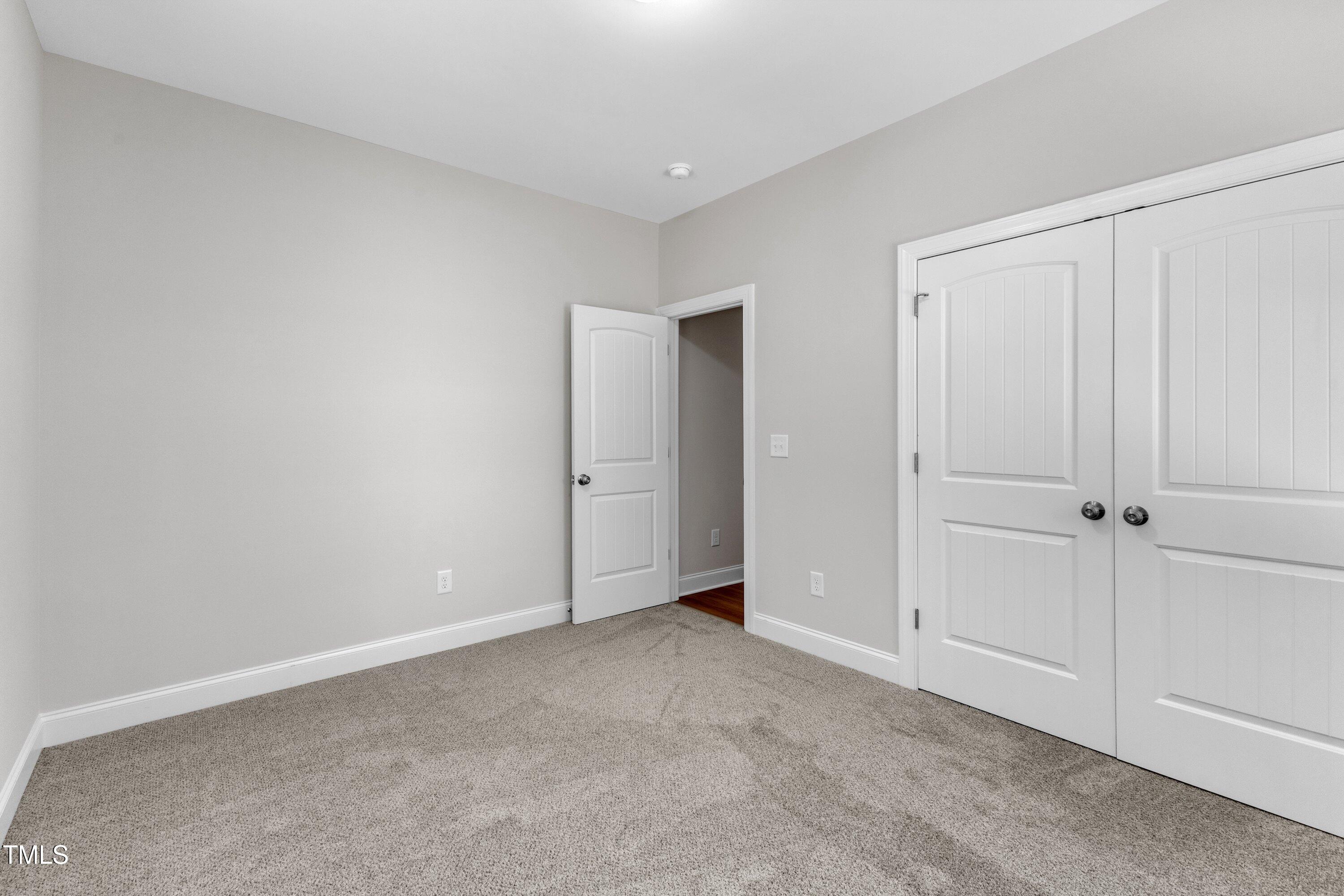 125 Davis Street Louisburg, NC 27549 - Photo 33 of 39 a view of an empty room and closet area