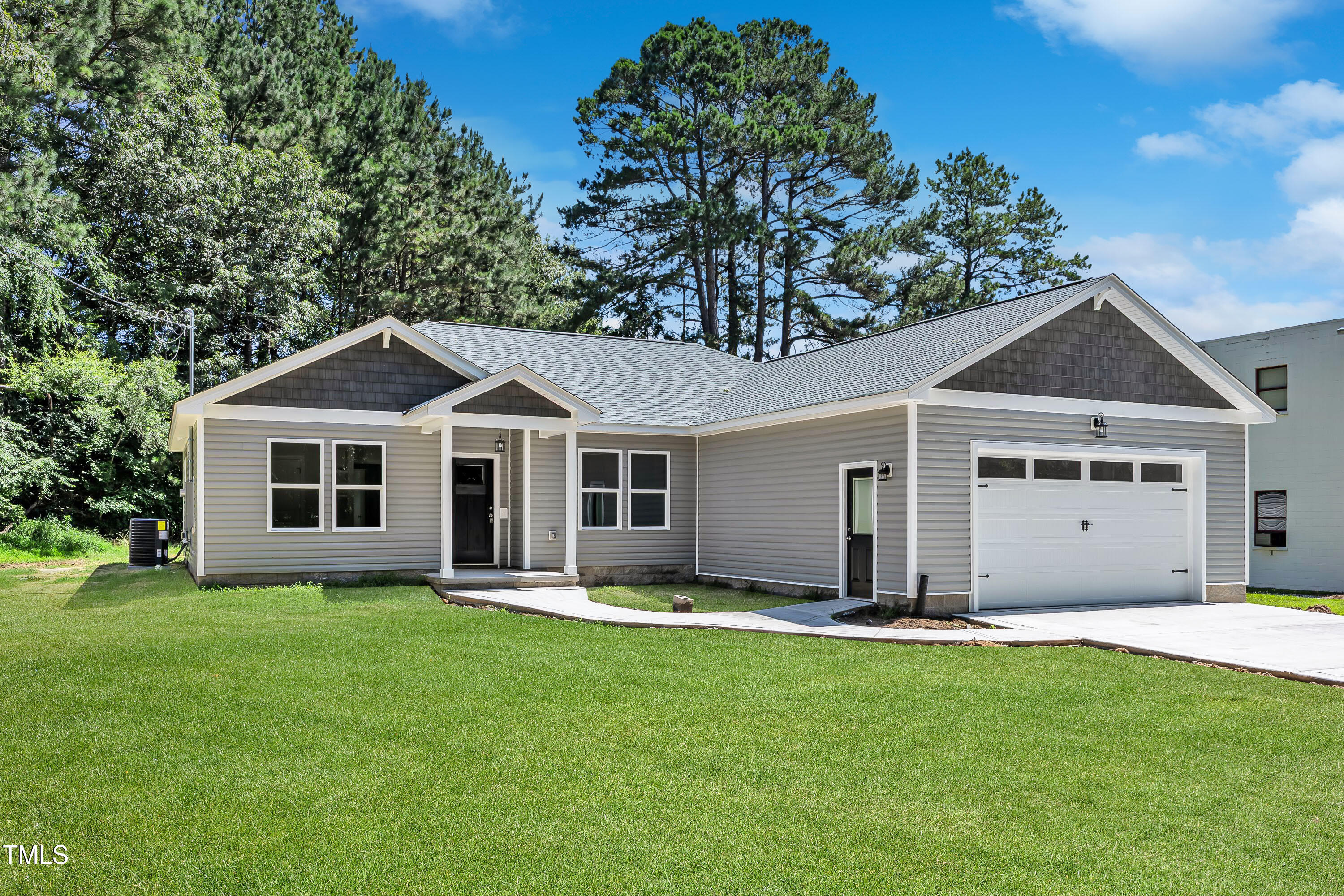 125 Davis Street Louisburg, NC 27549 - Photo 37 of 39 a front view of house with a garden