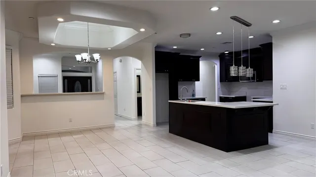 a kitchen with a refrigerator and a microwave