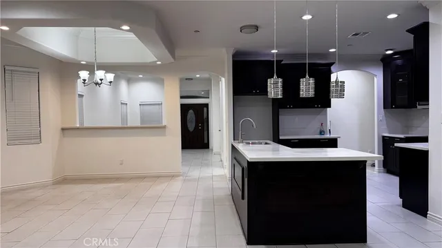a kitchen with granite countertop stainless steel appliances and wooden cabinets