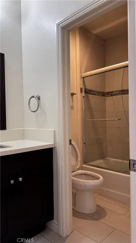 a bathroom with a sink vanity and mirror