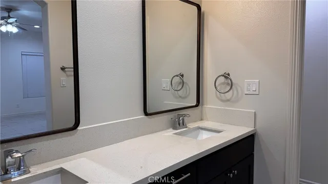 a view of a hallway to rooms