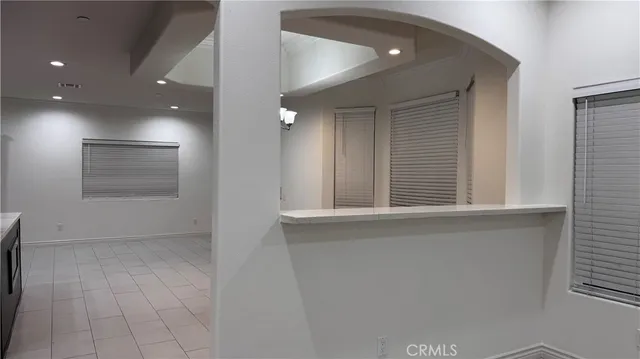 a view of a livingroom with a chandelier fan