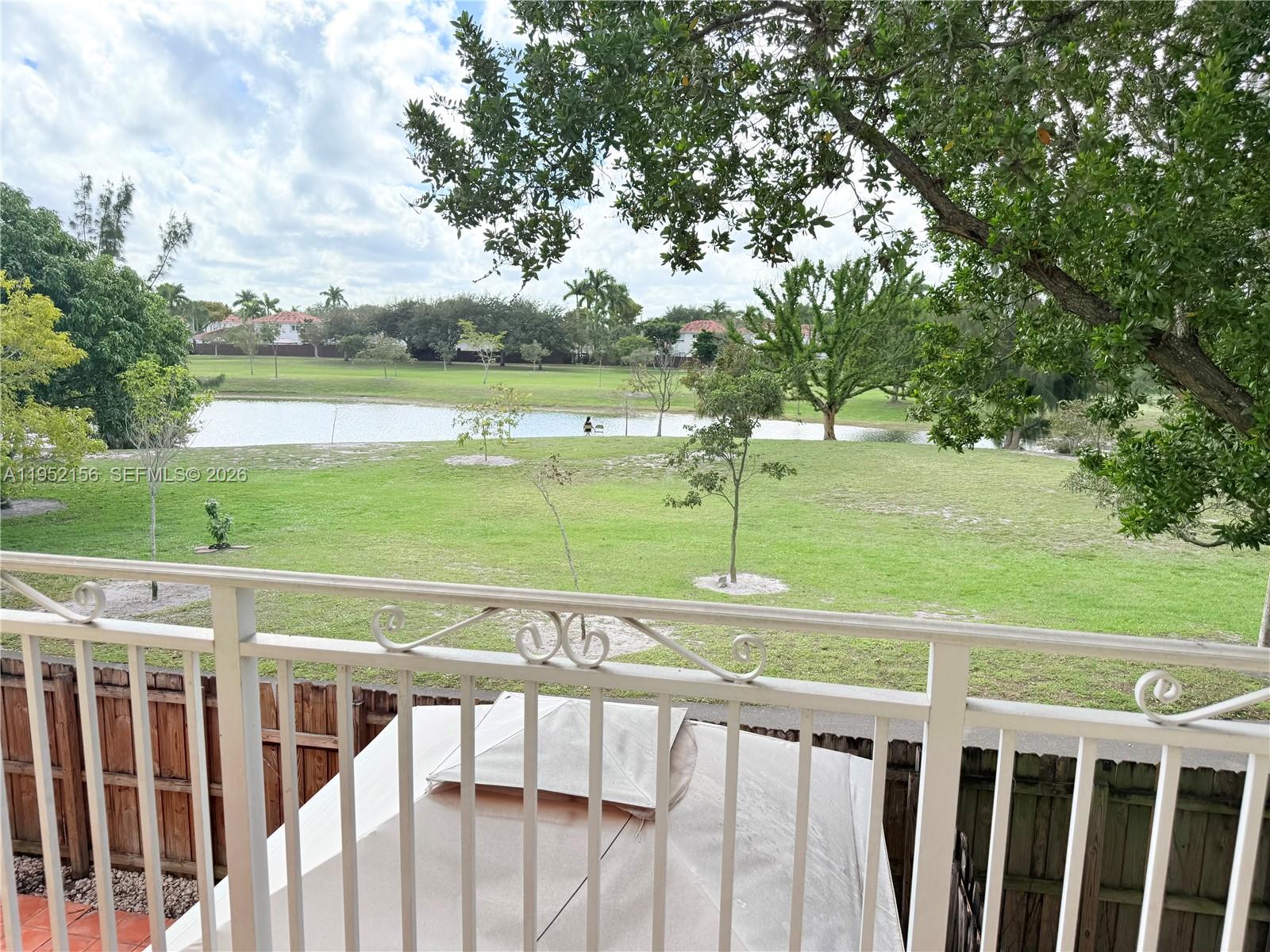 7330 Northwest 174th Terrace, Unit 204 Hialeah, FL 33015 - Photo 17 of 18 a view of an outdoor space and deck