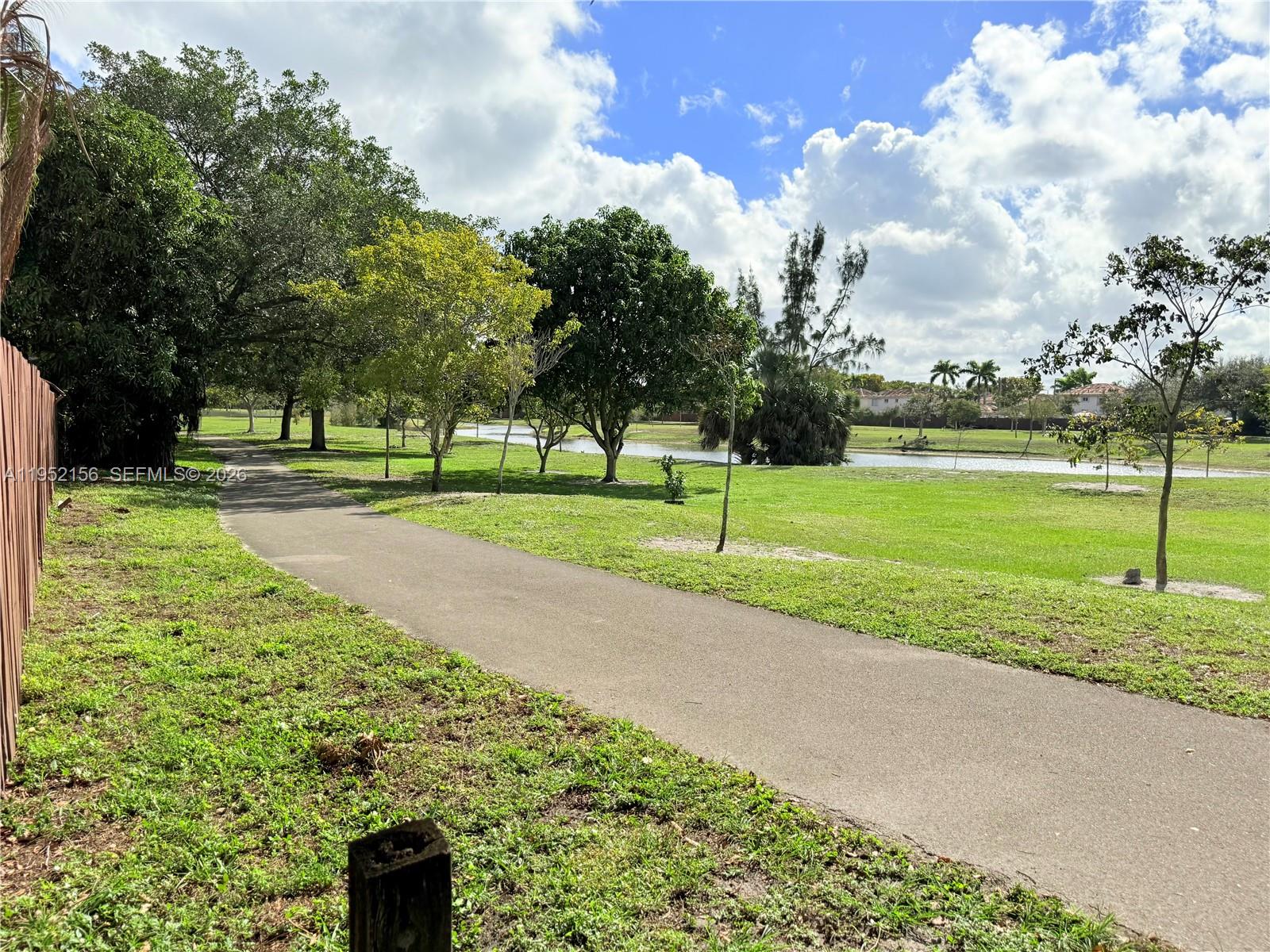7330 Northwest 174th Terrace, Unit 204 Hialeah, FL 33015 - Photo 18 of 18 a view of a park with large trees