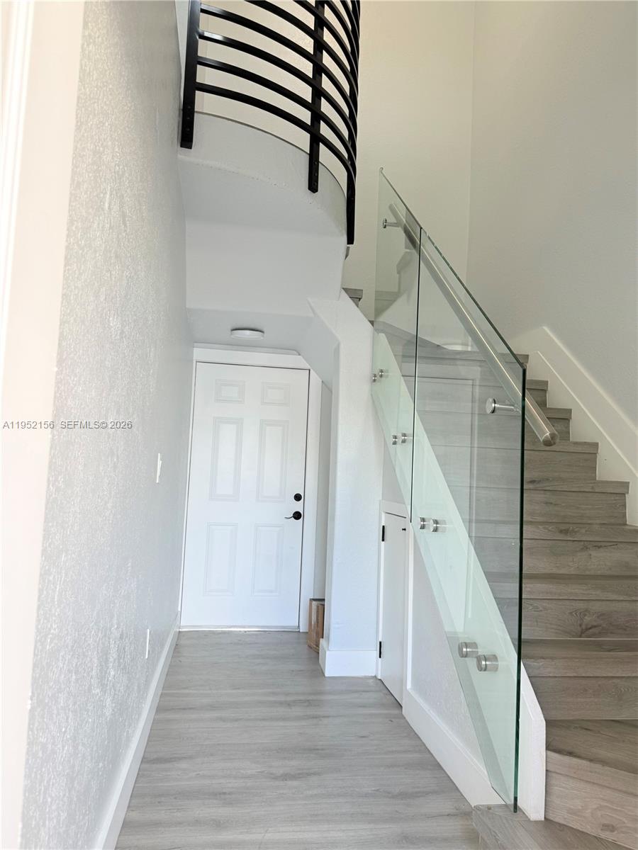 7330 Northwest 174th Terrace, Unit 204 Hialeah, FL 33015 - Photo 2 of 18 a view of entryway with wooden floor