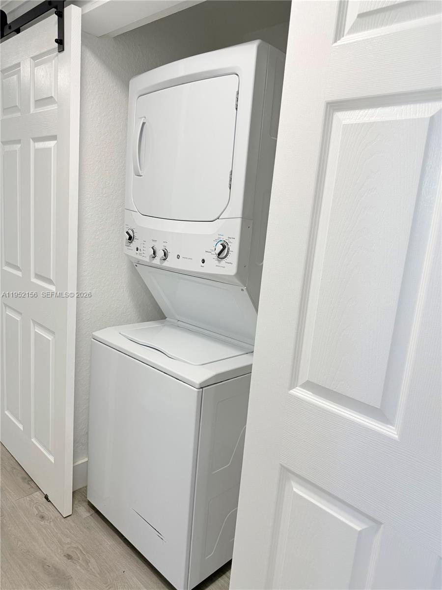 7330 Northwest 174th Terrace, Unit 204 Hialeah, FL 33015 - Photo 6 of 18 a utility room with dryer and washer