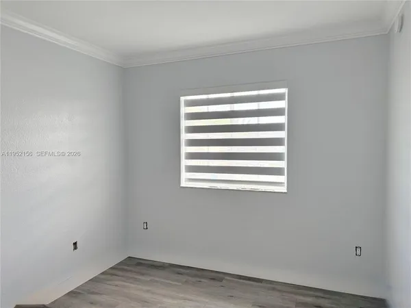 a view of a room that has a window