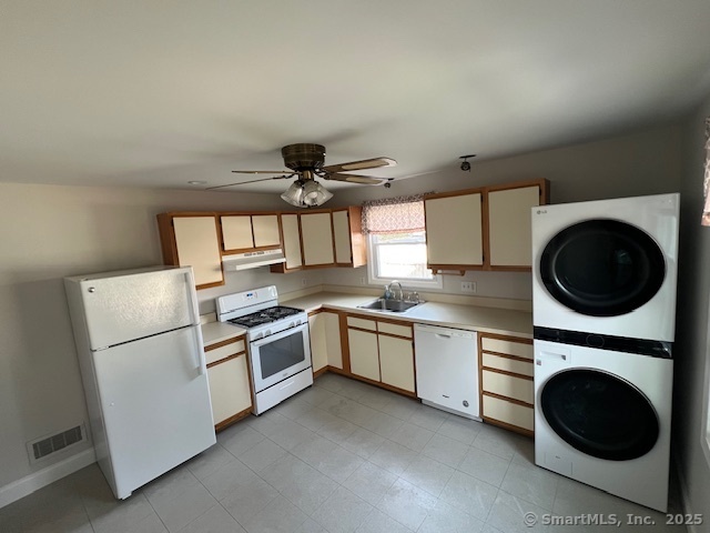 451 Meadow Street Fairfield, CT 06824 - Photo 4 of 9 a kitchen with a stove top oven sink and cabinets