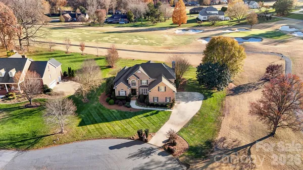 a view of a house with a yard and plants
