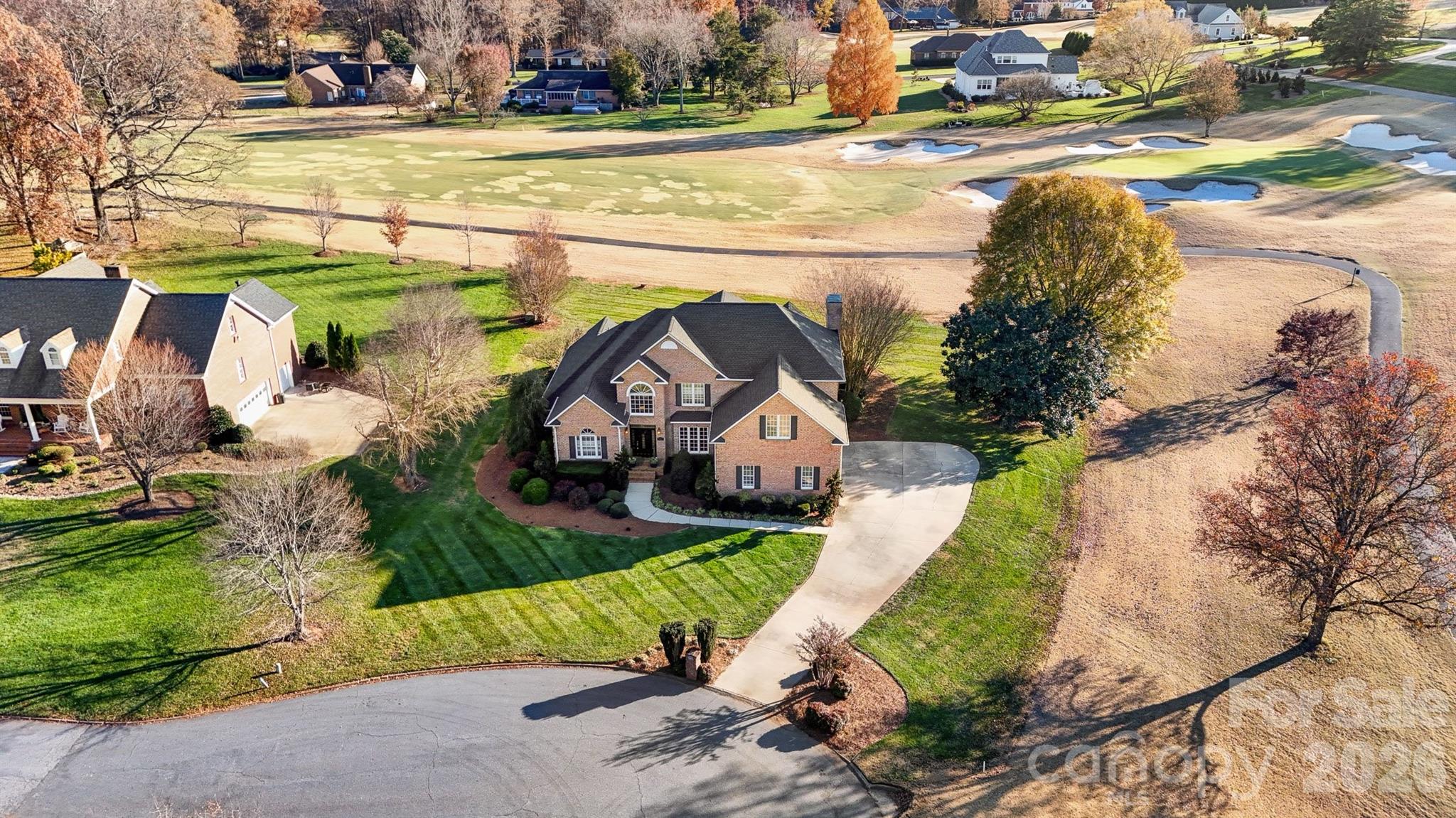 a view of a house with a yard and plants