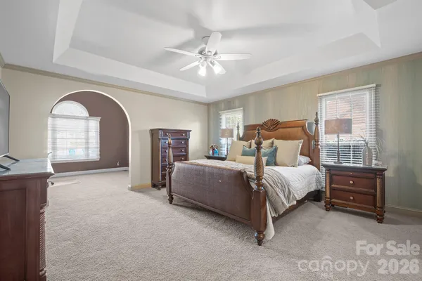 a bedroom with bed and window