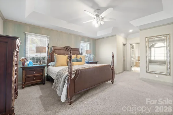 a bed room with a bed and a night stand